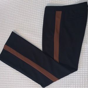 Ladies’ tuxedo style trousers . Black with sienna (brown) side detail. Loose fit